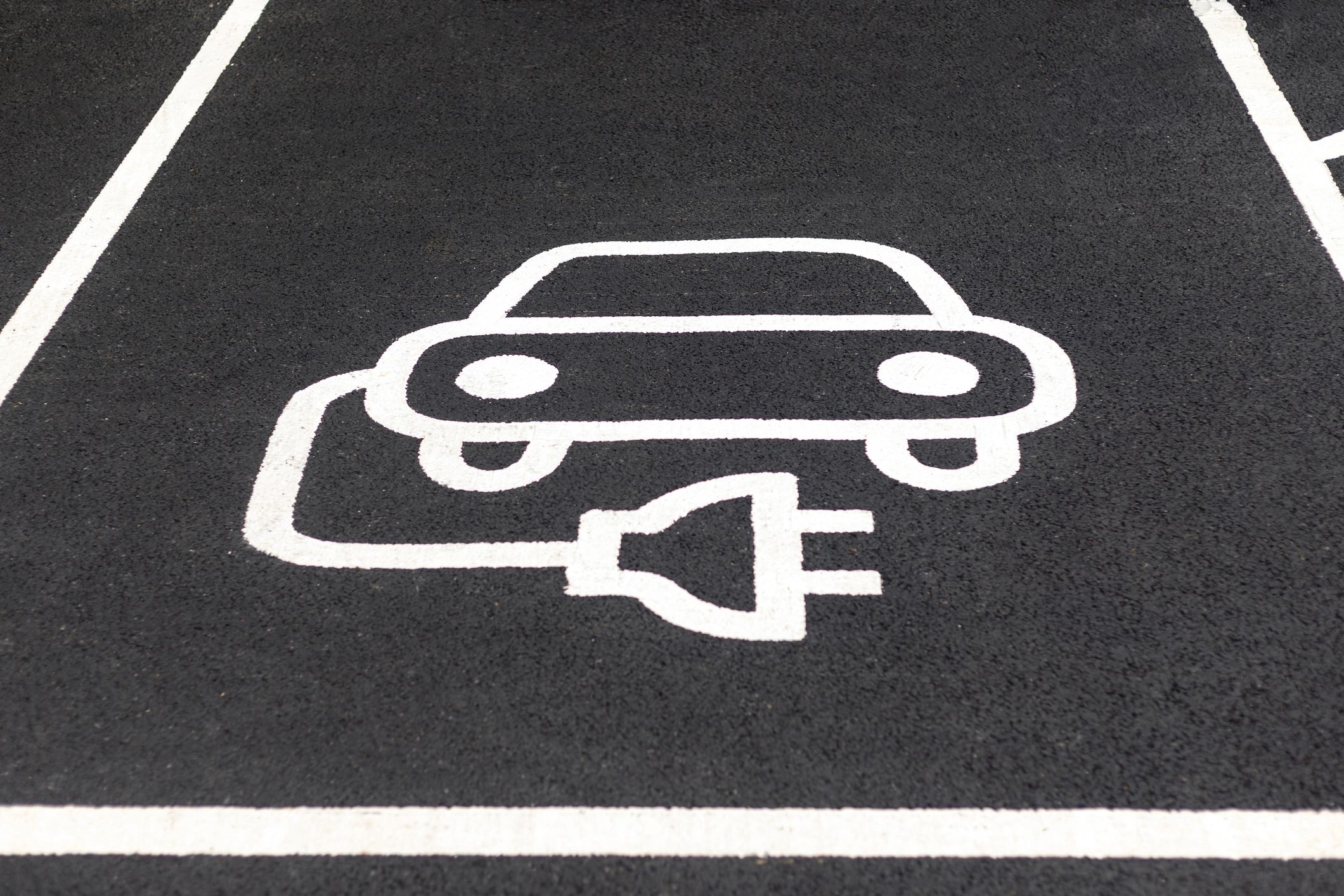 Electric vehicle charging bay marking for EV-focused private hire guidance